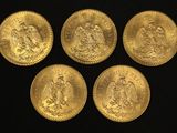four gold sovereigns with the image of jesus and mary on them
