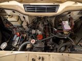 a picture of a car engine with its hood open