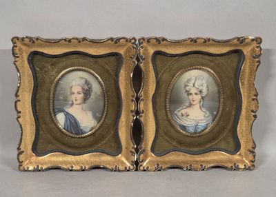 two framed portraits of a woman and a man in formal dress