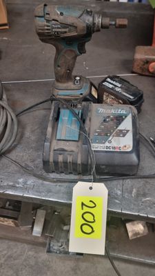 a corded drill on a table with a price tag on it