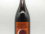 une image représentant une bouteille de vin avec un bouchon rouge