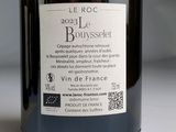 a bottle of wine sitting on a table with a label on it