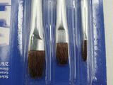 two red and silver paint brushes in a package on a white surface
