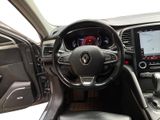 a picture of the interior of a car with a steering wheel and dashboard