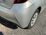 a silver car parked on the side of the road
