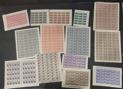 a table topped with lots of different types of stamps on top of each other