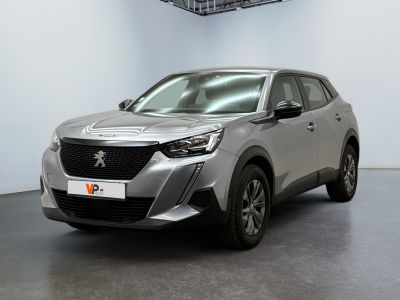the silver car is parked in a large room with a black floor