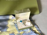 a box with a ring inside of it on a table