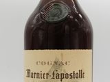 an image of a bottle of brandy sitting on top of a table