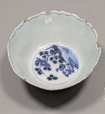 a blue and white bowl with a bird on it