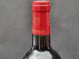 a bottle of wine that is sitting on a table