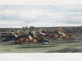 many people riding horses in a race on the grass