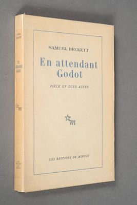 an old book on a gray surface with a star in the middle
