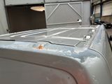 a close up of a truck with a broken hood