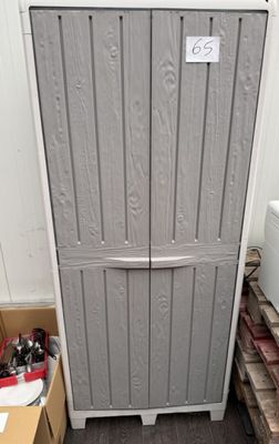 a refrigerator that is sitting in the corner of a room