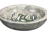 a bowl that has a bird design on it