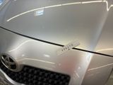 a close up of a car ' s hood with a sticker on it