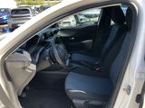 the interior of a car with the door open and the driver ' s seat up