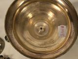 a silver bowl with a tag on it and a pair of silver spoons