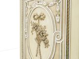 a white cabinet with a floral design on it