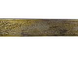 an image of a brass plate with a design on it