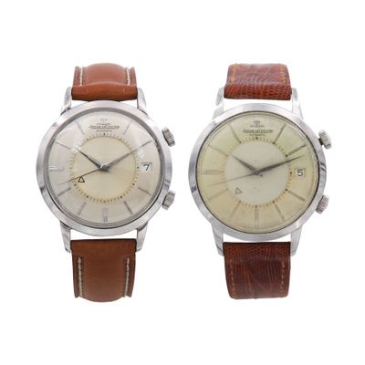 an image of a couple of watches sitting next to each other