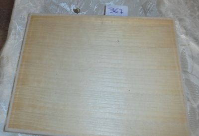 a picture of a piece of wood that is on a table