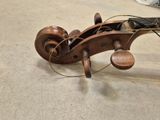 a violin that is sitting on the floor