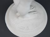 a statue of a person standing on top of a pedestal
