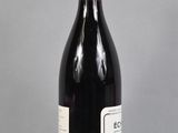 a bottle of wine that is sitting on a table