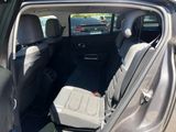 the back seats of a car are empty in a parking lot