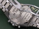 a watch that is sitting on a green surface