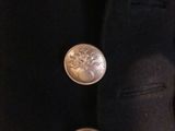 an image of a jacket with buttons on it