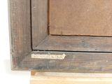 a close up of a picture of a wooden frame