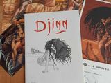 three books on a wooden table with drawings of women and men