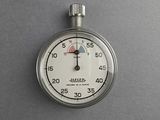 a stopwatch that is on a gray surface