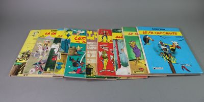 a bunch of comics sitting on top of a table next to each other