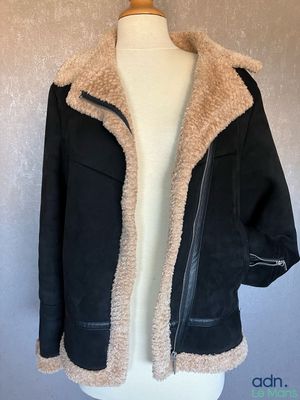 the jacket is black and tan with a faux lining