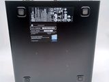the back of a laptop with a battery on top of it