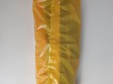 a yellow bag of food on a white surface