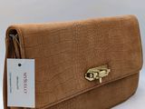 an image of a brown purse with a tag on it