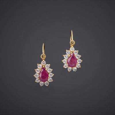 a pair of ruby and diamond earrings