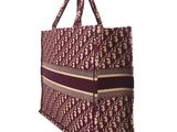 an image of a brown and red tote bag on a white background