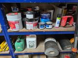 a shelf with many different types of paint on it