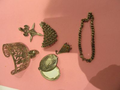 a lot of different items that are on a pink surface