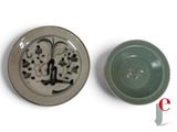 a small bowl and a small bowl sitting on a table