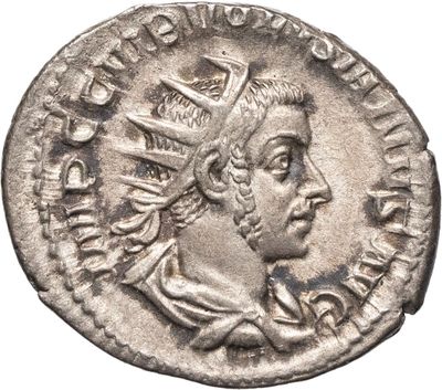 Pièce d'argent portant l'image d'un homme portant une couronne.