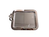 a small silver tray with a flower on it