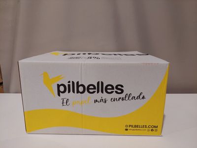 the box of pills is sitting on a table next to a chair