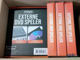 three dvds in a box on the shelf